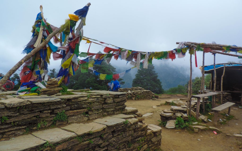 Prayer flags over the moutain ridge, a common sight whilst trekking in Nepal